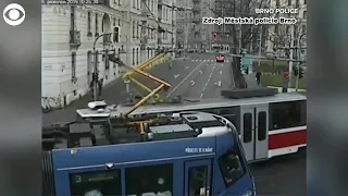 WEB EXTRA: Car Sandwiched Between Two Trams