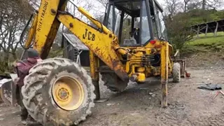 The JCB 3CX ended up with a puncture!  Watch one man and his dog try fixing it!