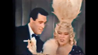 Mae West, baby it's cold outside with Rock Hudson in color