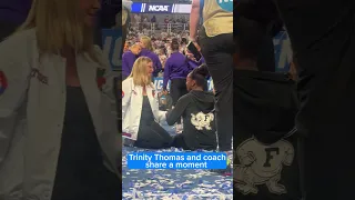 Trinity Thomas and coach share a moment
