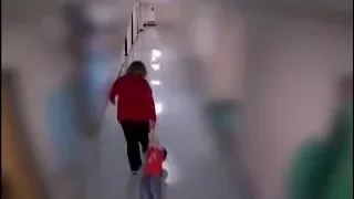 Special needs teacher drags student down hallway | SECURITY VIDEO