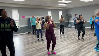 Traci and roddi with their zumba class dance to cobarde bachata