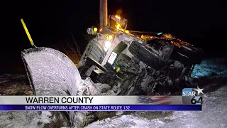 Snowplow slides off road in Harlan Township