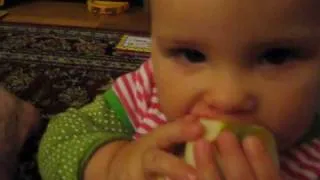 Baby's Arm Holding an Apple (and eating it...)