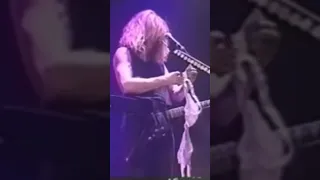 Dave Mustaine with a BRA on stage