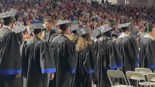 CAPS OFF: FGCU grads make their way across the stage