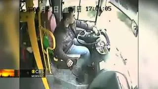 Bus driver in China has near-death close call