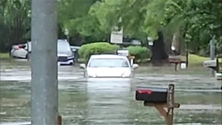 Driver tries to get through high water along Humble street