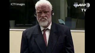 War criminal takes poison in court