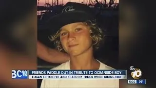 Friends paddle out in tribute to Oceanside boy