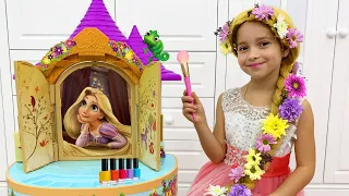 Sofia as Rapunzel plays in a beauty salon in her Princess Room