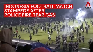 Indonesian football match stampede: At least 125 dead after fans storm pitch, police fire tear gas