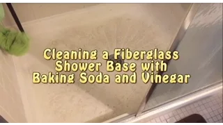 Cleaning shower base with baking soda and vinegar