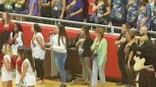 Julia sings National Anthem at pep rally