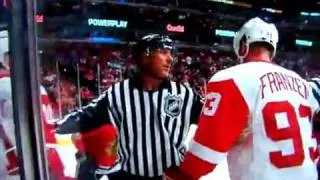 At 0:07, a Hockey referee materializes out of nowhere.