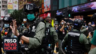 News Wrap: Hong Kong police arrest at least 60 protesters