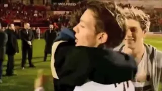 Harry supporting Louis during his football game