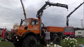 Unimog 2450 with crane folding up