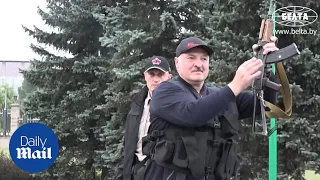 Belarus: President Alexander Lukashenko carries RIFLE as protesters demand his resignation