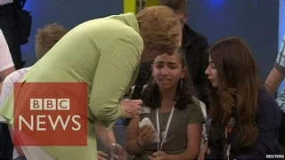 Angela Merkel criticised over crying refugee - BBC News