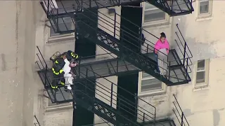 7 transported, baby critical after high-rise fire on South Side