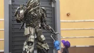 Kid gives Megatron Optimus Prime's head - happy Megatron