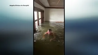 Hurricane Ian: Man floats around flooded Naples home