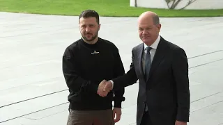 Zelensky meets German Chancellor Scholz with military honors | AFP