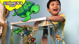 Toddler fishing his toys in A REAL AQUARIUM! Robo Alive Fish and Turtle toys for kids