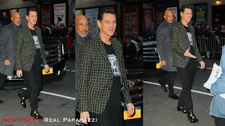 Jim Carrey signs autographs while arriving at The Late Show with Stephen Colbert.