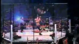 AJ styles cross body dive from the top of the cage