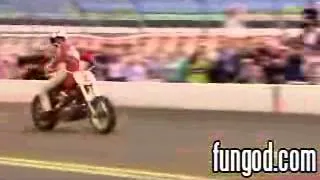 Motorbike Jumping Cars a Stunt Rider Riding Backwards on Motorcycle Jumps Ramp to Ramp over Cars