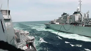 USS Ross (DDG 71) conducts refueling replenishment-at-sea with fast combat support ship USNS Supply