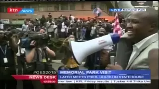 Members of the public shuts an intruder during President Barack Obama's visit