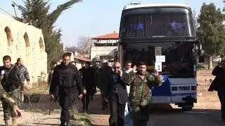 Civilians evacuated from Syria's besieged Homs