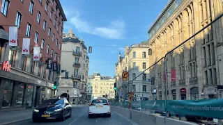 Driving in central Stockholm. Sounds of traffic and Swedish radio