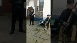 An old man sings Ukrainian Folk song in a church yard - Місяць на небі