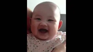 3 months old cute little baby laughing