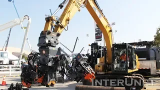 Caterpillar Excavator with OilQuick Coupler System Adjustable Utility Arms Demonstration