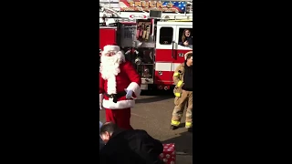 Santa surprises little girl with puppy