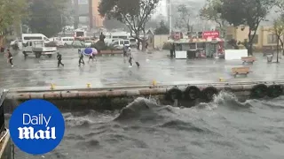 People run as heavy rain batters Istanbul and brings flooding - Daily Mail