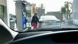 Blonde Tesla driver at gas station. LOL 😆