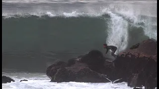 Surfing in front of unforgiving rocks in LA
