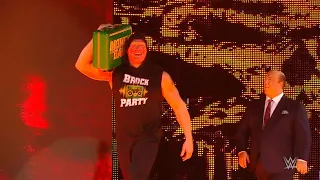 Brock Lesnar celebrates his Money in the Bank win on Raw