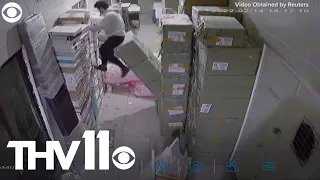 Person falls through hole in floor & gets saved by boxes