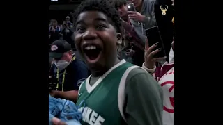 Giannis Antetokounmpo giving his shoes to a young fan 🥺#nba #shorts #bucks #giannisantetokounmpo