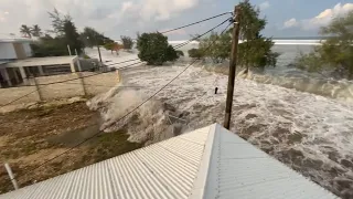 Footage shows waves crashing into homes as tsunami warning announced for all of Tonga