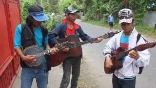 Musicians at the door in Dumaguete, Philippines - Dec 25, 2013 (part 2)