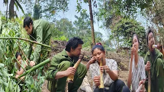 The girl helped the boy get the tree, causing the tree to fall ổn top of them