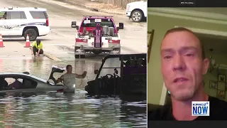 Good samaritan helps pull car out of high water